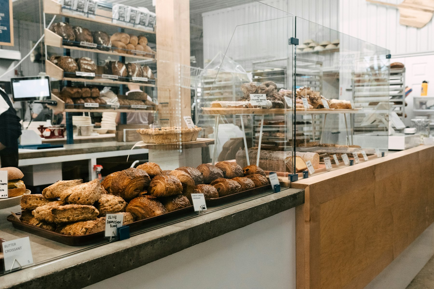 Menu Bakery counter filled with fresh pastries and baked goods