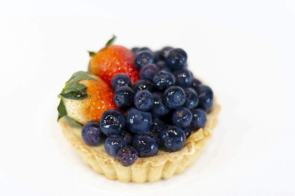 Custom Cakes Fruit tart topped with fresh blueberries and strawberries