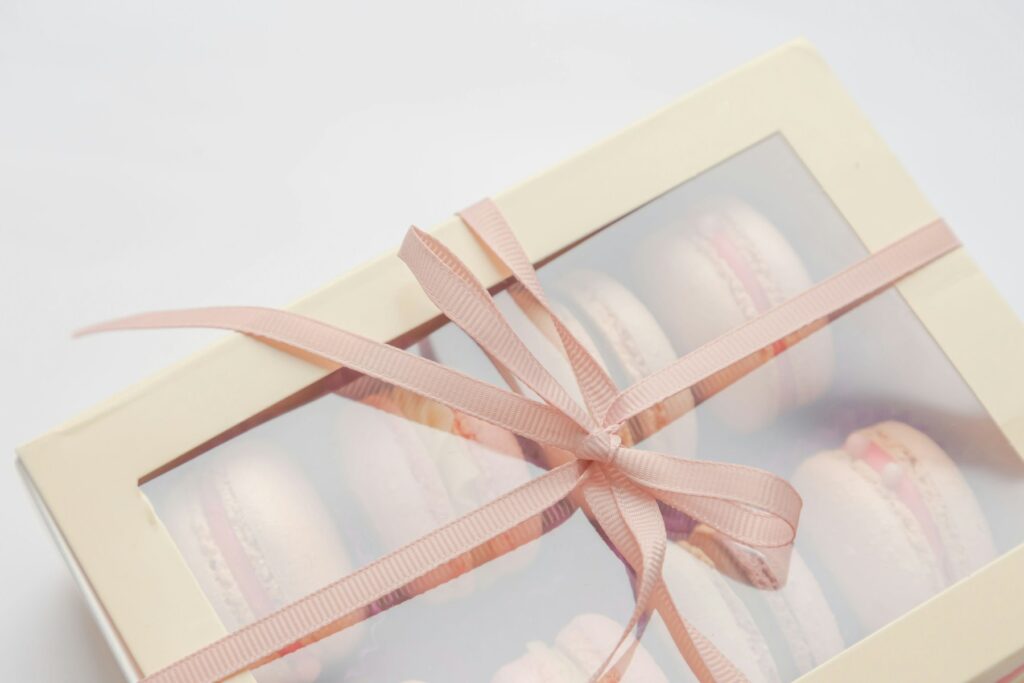 Shop Gift box of macarons tied with a pink ribbon