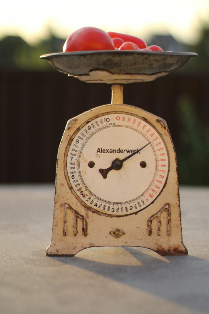 A vintage mechanical kitchen scale reading zero
